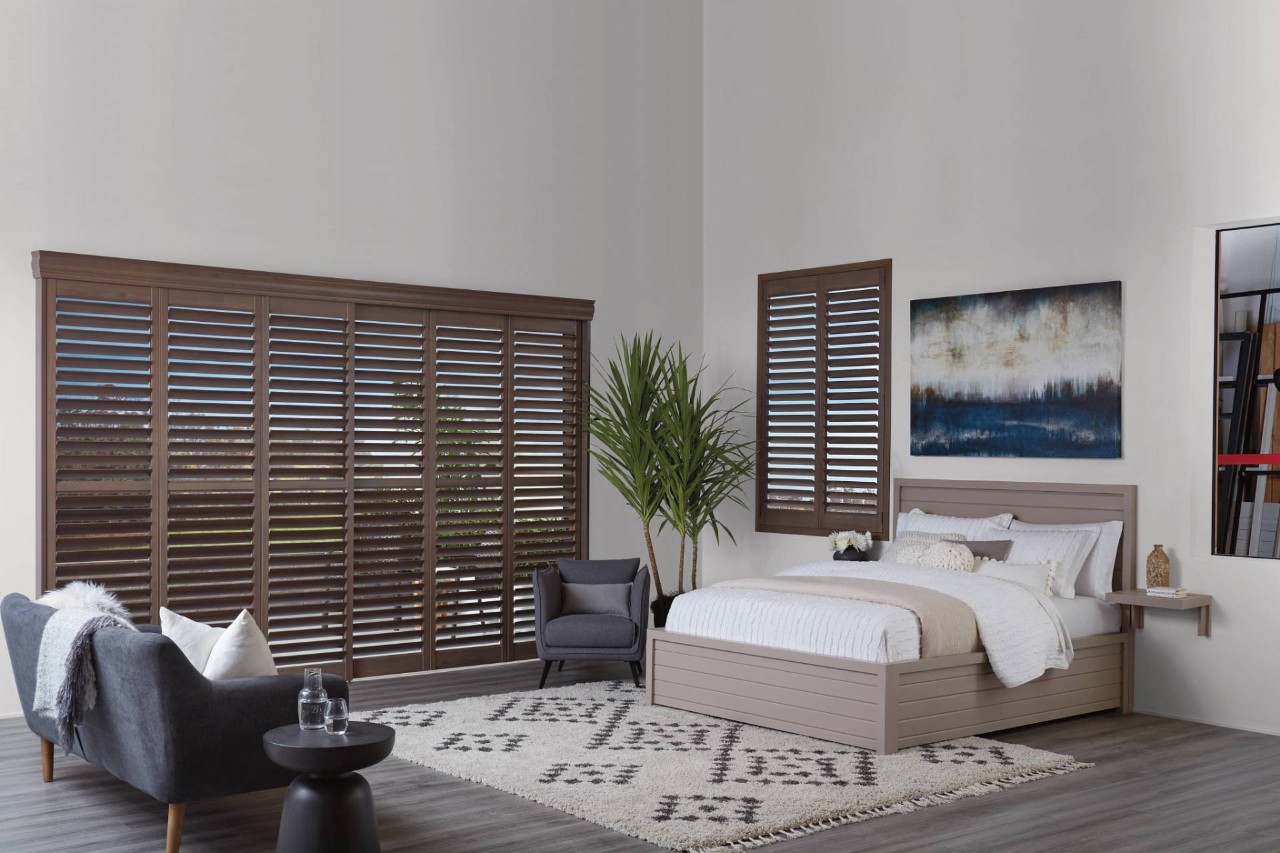 Hunter Douglas NewStyle® Hybrid Shutters covering a window in a contemporary bedroom, Hayden, ID