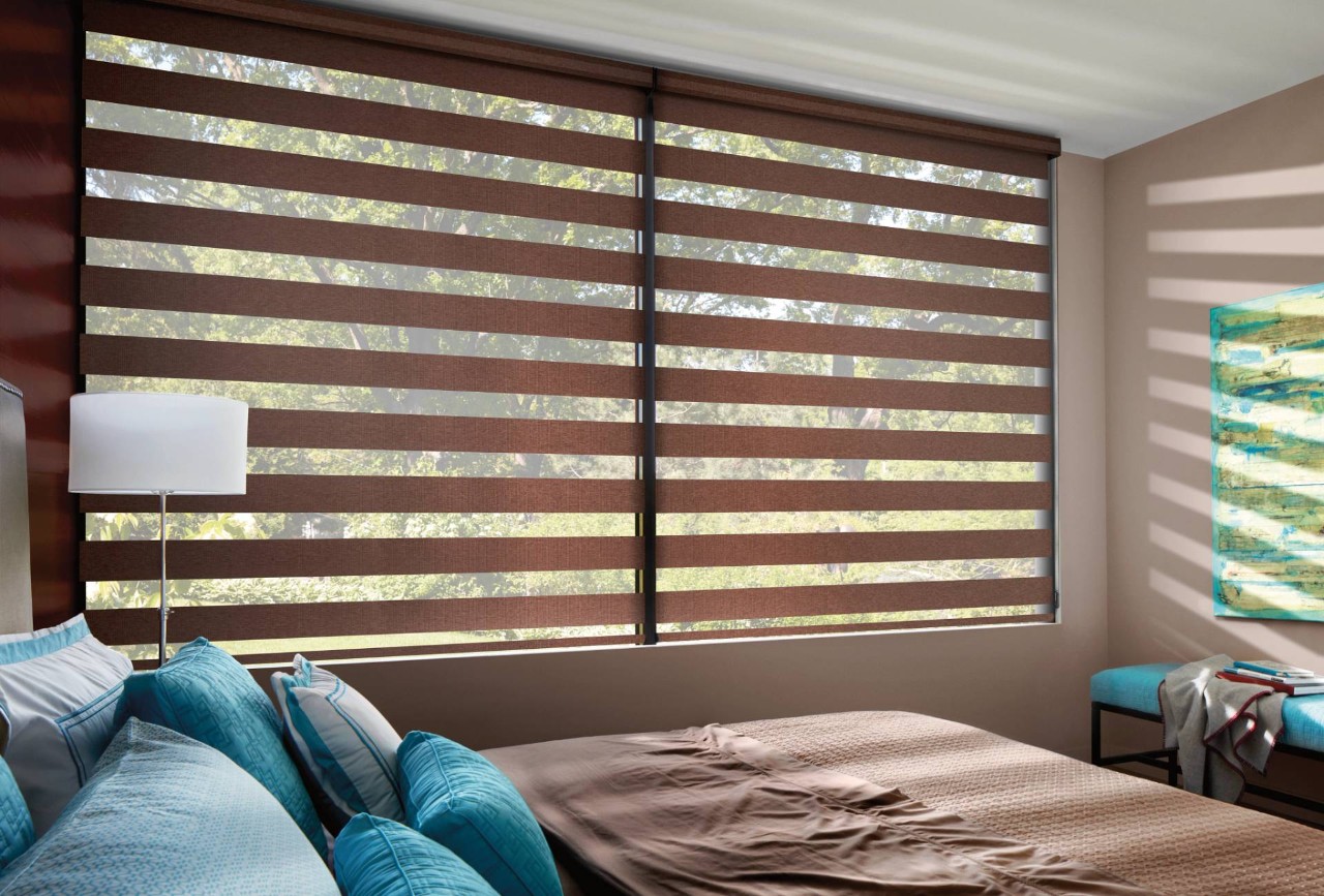 Hunter Douglas Banded Shades hanging in a bedroom near Hayden, ID