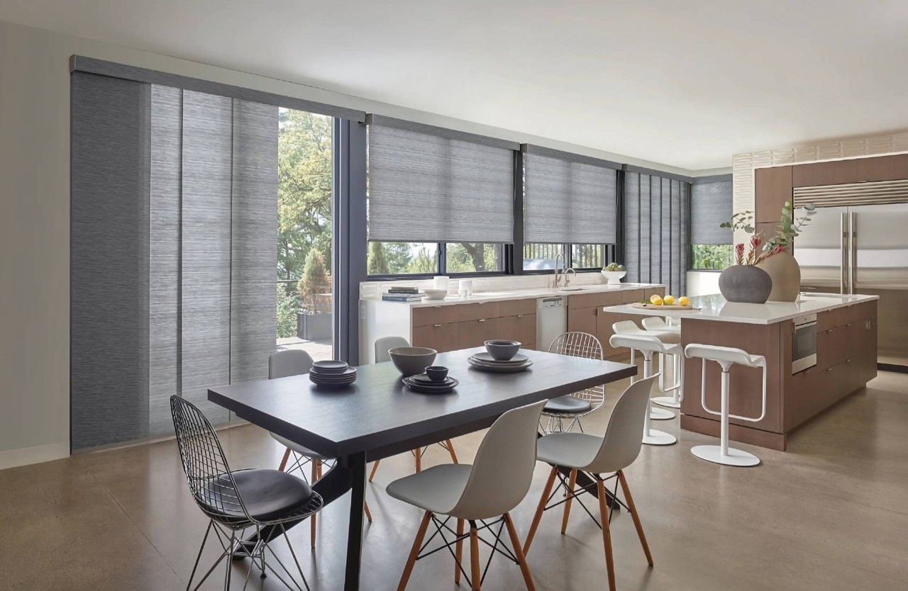 Skyline® Panel-Track Blinds on a sliding door serving as glass door window treatments in a kitchen at North Idaho Blinds, Shades & Shutters near Hayden, ID